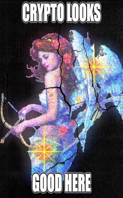 A meme featuring a glittery, colorful crystalline fantasy figure with text reading 'CRYPTO LOOKS GOOD HERE' in classic meme format.