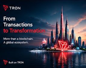An advertisement for TRON blockchain with the text "From Transactions to Transformation", "More than a blockchain. A global ecosystem.", and "Built on TRON" displayed over a futuristic cityscape.