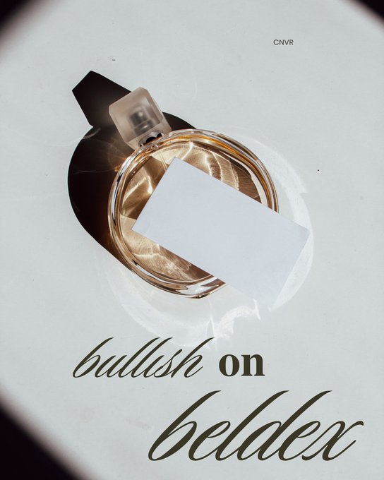 A photograph of a perfume bottle viewed from above with a blank label, featuring the text 'CNVR' and 'bullish on beldex' in stylized script on a white background.