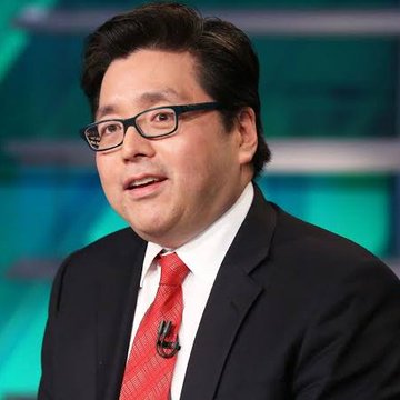A man with glasses, wearing a dark suit and red tie, speaks during what appears to be a televised interview.