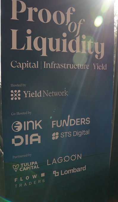 A dark promotional sign reading 'Proof of Liquidity: Capital | Infrastructure | Yield', hosted by Yield Network, co-hosted by ONKDIA, Funders, STS Digital, and partnered by Tulipa Capital, Lagoon, Flow Traders, and Lombard.