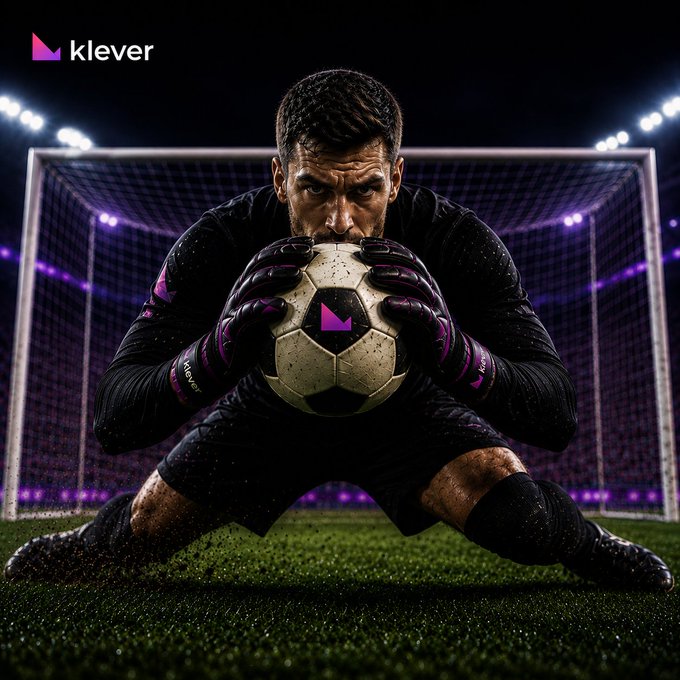 The image features a soccer player kneeling down with his hands on a soccer ball, possibly preparing for a kick or just after scoring a goal. The background of the photo shows a stadium filled with spectators, emphasizing the importance of the moment captured in the picture. The caption "Every champion needs a strong defense. Self-custody puts you in control of your assets - no substitutes, no third parties. Your keys." highlights the significance of the player's role and his connection to the sport.