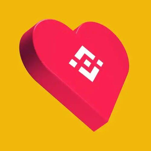 A 3D illustration of a pink heart with the Binance logo on it, set against a solid yellow background.