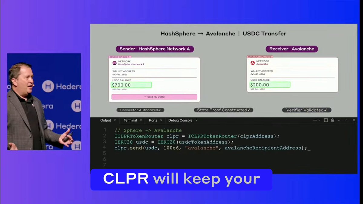 The image shows a man giving a presentation with a computer screen behind him displaying information about CLPR and hashgraph. The text on the screen reads "CLRP will keep your data safe". This suggests that the image might be related to a presentation or discussion about CLPR, which is a ledger technology designed for state proofs and smart contracts. It could also be an advertisement promoting the use of hashgraph in securing data.