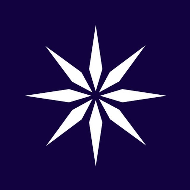 A white eight-pointed compass star or compass rose design centered on a dark navy blue background.