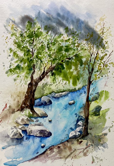 A watercolor painting of a serene landscape featuring a blue stream flowing between rocks, flanked by two green trees.