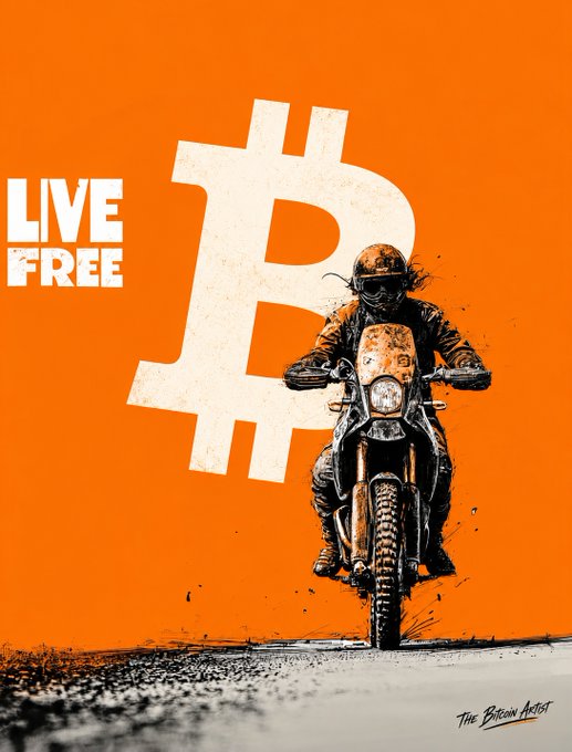 An artistic poster featuring a motorcyclist riding against a vibrant orange background with a large Bitcoin logo and the text 'LIVE FREE', credited to 'The Bitcoin Artist' in the corner.