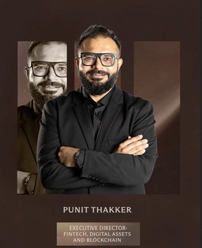 The image features a man wearing glasses standing next to another man who is also wearing glasses. They are both smiling at the camera. The background of the image is dark brown, which contrasts with the two men's faces. The text "Punit Thakker" and "Fintech, Digital Assets, and Blockchain" can be seen in the image as well.
