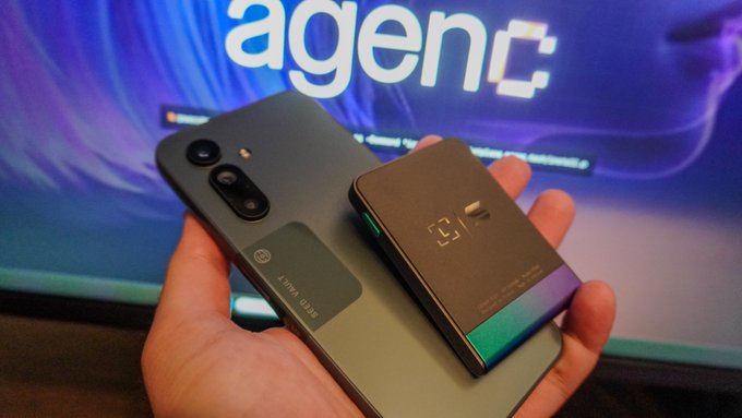 A hand holds a gray smartphone alongside a black Ledger Flex hardware wallet in front of a screen displaying the "agenC" logo, visually illustrating the post's announcement of integrating the AgenC app with Ledger Flex for safer onchain transactions by Solana Mobile AI agents.