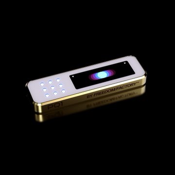 A sleek, gold-trimmed hardware wallet with a screen displaying a glowing icon, branded "FREEDOMFACTORY" with the number "1" on its side, sits on a reflective black surface. The caption references post-quantum cryptography (SPHINCS+) verified through an ERC-4337 smart account, suggesting this device aims to challenge established hardware wallet leaders like Ledger and Trezor with quantum-resistant security.