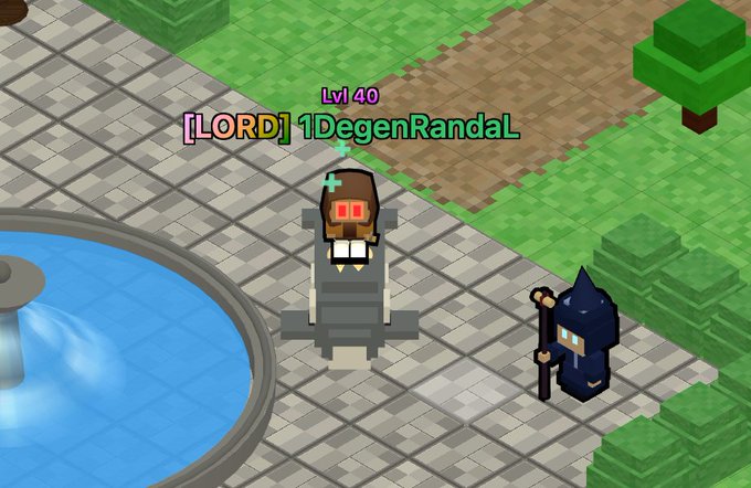 A screenshot from a voxel-style video game shows a Level 40 character named '[LORD] 1DegenRandaL' wearing red goggles, standing near a fountain alongside a small hooded NPC holding a staff.