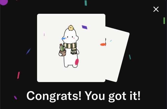 A cute white cartoon character holding a potted plant appears on a card with the text "Congrats! You got it!" displayed below, likely celebrating a successful capture or collection within The Gloobs app.