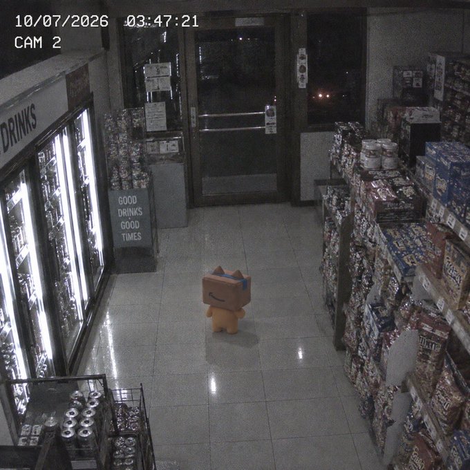 Security camera footage (CAM 2, 10/07/2026 03:47:21) shows a small costumed character in a convenience store near the exit, surrounded by drink coolers and snack shelves.