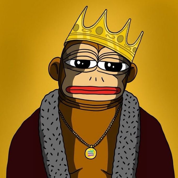 A cartoon illustration of a monkey wearing a golden crown, a fur-collared robe, and a colorful chain pendant against a yellow background.