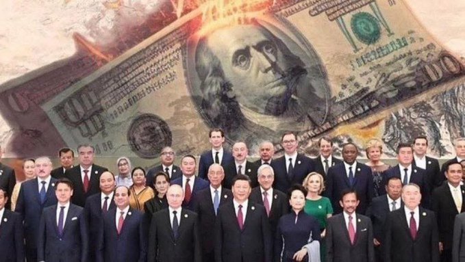 The image features a group of people dressed in suits, standing together for a photo. The backdrop behind them shows a large amount of money, with flames coming out of it, creating an intense atmosphere. The caption above the image reads "BREAKING : Reports confirm that BRICS have moved away from the dollar and are discussing with Ripple to establish a global Central Bank Digital Currency (CBDC) on the #XRP ledger." This suggests that there is a significant shift in the financial landscape of the BRIC countries, as they move away from traditional currency systems like the US dollar. The image also includes a reference to Ripple, which is a digital currency platform, further indicating this change in the global financial system.