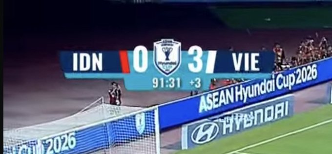 A sports broadcast scoreboard showing IDN 0 vs VIE 3 at 91:31 +3, with 'ASEAN Hyundai Cup 2026' branding along the sideline.