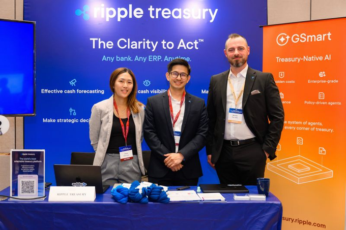 Three Ripple Treasury representatives stand at a booth labeled “Ripple Treasury — The Clarity to Act” at Finance ReImagined Malaysia. Neal Cooper, Director of Cash Forecasting for EMEA and APAC, discussed why treasury teams need more than forecast accuracy in volatile markets, emphasizing that forecasts create value only when translated into timely, informed action.