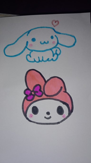 A hand-drawn illustration on white paper featuring Cinnamoroll (a cute puppy character with floppy ears) above My Melody (a character with a pink hood and bow).
