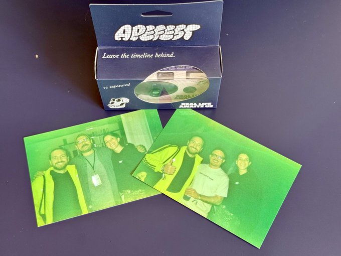 The image shows two photos of people, one green and one black, sitting next to each other with their backs facing the camera. The green photo has a caption that reads "Sunday surprise Out of the 12 pictures from the camera only 2 were able to be developed the photo lab said". This suggests that there are at least two photos in the image, but not all of them have been developed yet.