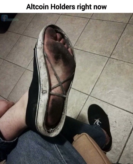 The image shows a meme captioned "Altcoin Holders right now," depicting a completely worn-out sneaker with the sole completely separated from the upper, exposing the foot inside—an apt visual metaphor for how battered and broken down altcoin investors feel after recent market losses. The accompanying post humorously distances INJ from the altcoin label, joking that its holder refuses to be lumped in with the "destroyed shoe" crowd of other altcoin sufferers.