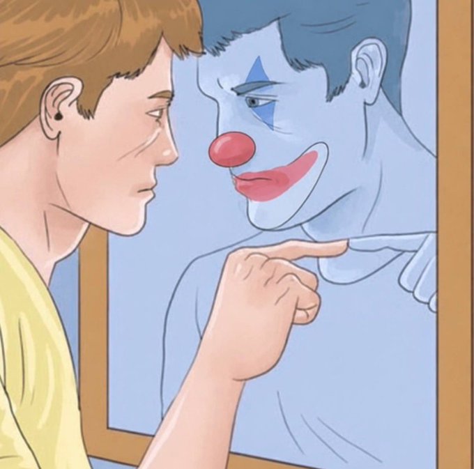 A young man in a yellow shirt points accusingly at his reflection in a mirror, revealing a clown with a red nose and blue-painted face staring back. The image plays on the post's saying by showing how someone convinced they're making smart trades is actually deceiving themselves—just like the man failing to recognize his own clownish reflection.