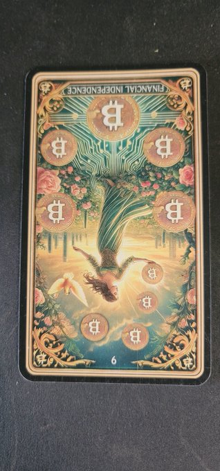 A tarot-style card features the Bitcoin logo and the text 'FINANCIAL INDEPENDENCE,' showing a woman floating underwater surrounded by Bitcoin coins and flowers.