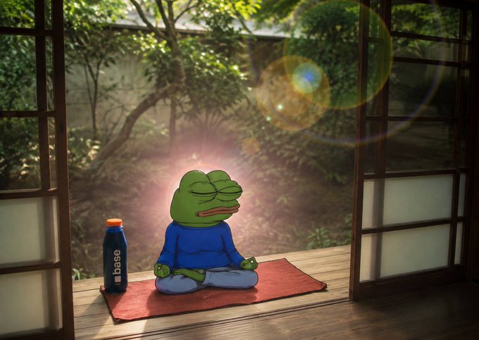 A weary Pepe the Frog sits cross-legged in meditation on a yoga mat at a sunlit doorway, accompanied by a blue bottle labeled "base" — visually reinforcing the post's claim that $BASEJUICE is a legitimate, "based" product created by the Base ecosystem rather than a random meme.