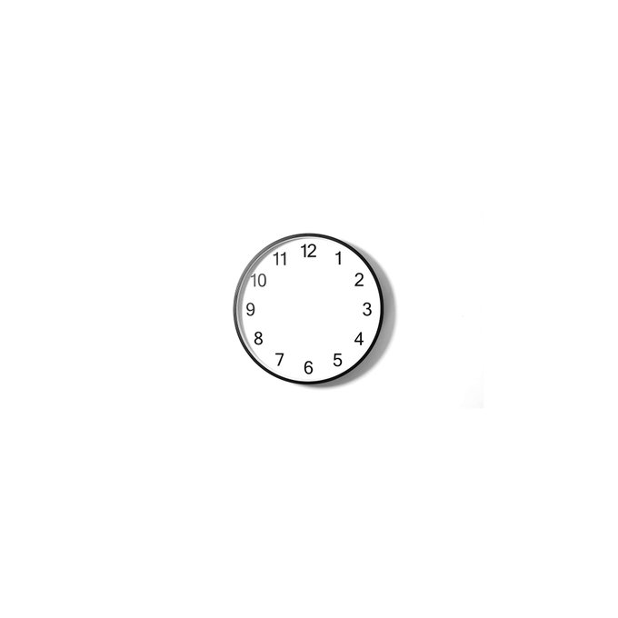A simple round wall clock with a black frame and white face showing numbers 1-12 mounted on a white wall.