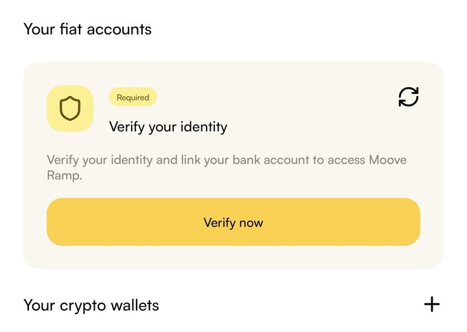 A mobile app screen showing 'Your fiat accounts' with a 'Required' status prompting users to 'Verify your identity' and link a bank account to access Moove Ramp, featuring a yellow 'Verify now' button and a 'Your crypto wallets' section below.