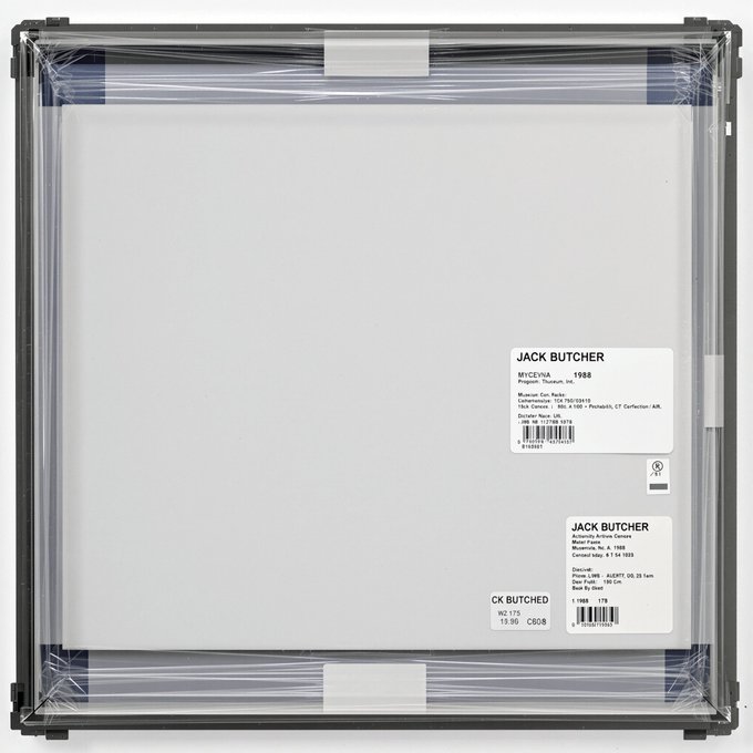 A framed artwork titled "MY/CV/NA 1988" by Jack Butcher, sealed in clear plastic and featuring two white identification labels on the back listing the artist's name, Medium (Digital), Canvas (Linen), and Edition details. The labels confirm the piece's provenance and match the accompanying post noting the work was collected by @djkero on Verse Secondary for $101 (Ξ0.0644) on Ethereum.