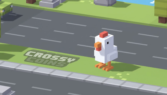A pixelated chicken stands on a sidewalk near a road in the mobile game Crossy Road, with the text 'CROSSY COINS' visible on the grass.