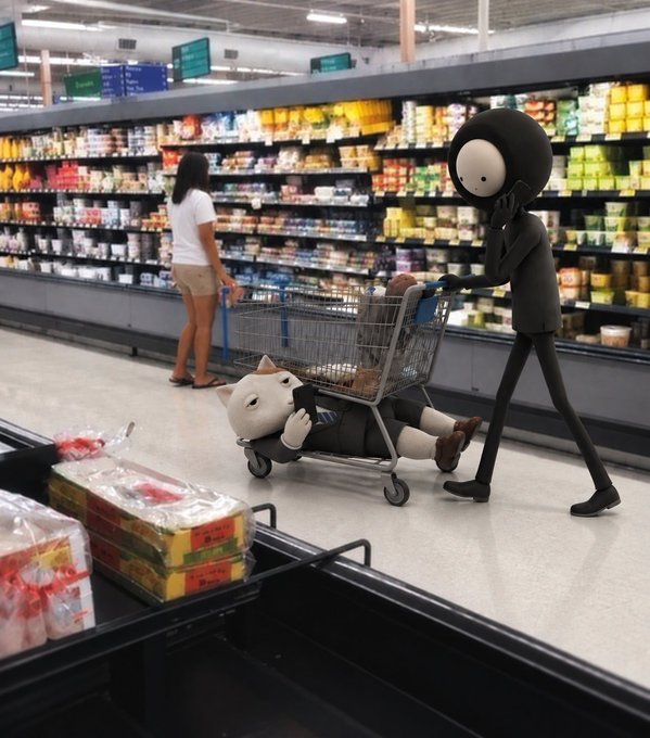 In a brightly lit grocery store aisle, a black cartoon character pushes a shopping cart containing a small white character lying down, while a woman browses the shelves in the background.