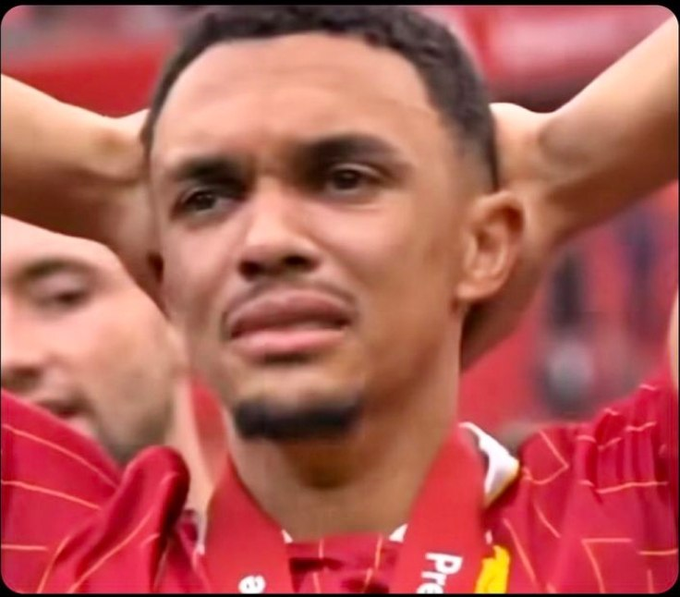 A close-up shows a Liverpool FC soccer player wearing the team's red jersey with hands on his head, looking distressed and exasperated. The image humorously mirrors the post's sentiment about feeling hopeless at the prospect of "Saylor" (likely referring to a trader selling) again, capturing the dejected reaction of a worried fan.