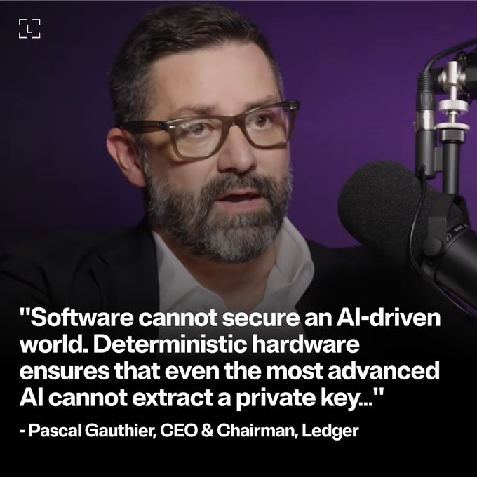 The image shows a man with glasses and a beard speaking into a microphone against a purple background, with a quote attributed to Pascal Gauthier, CEO & Chairman of Ledger, stating: "Software cannot secure an AI-driven world. Deterministic hardware ensures that even the most advanced AI cannot extract a private key…" The image visually reinforces the post's message about hardware-based security being the essential safeguard against AI-driven threats that software alone cannot defend against.