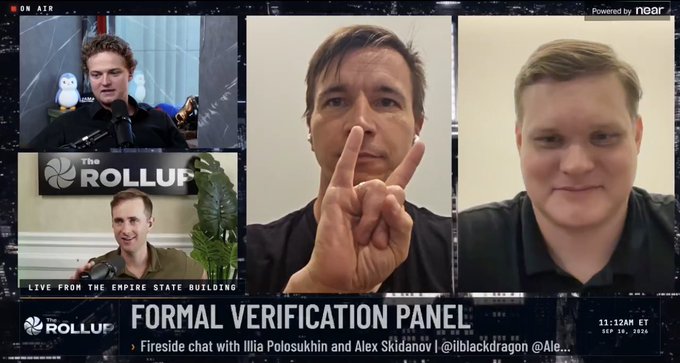 A split-screen video panel titled 'FORMAL VERIFICATION PANEL' from 'The ROLLUP' featuring a fireside chat with Illia Polosukhin and Alex Skidanov (@ilblackdragon), with four men visible across the frame and 'LIVE FROM THE EMPIRE STATE BUILDING' text.