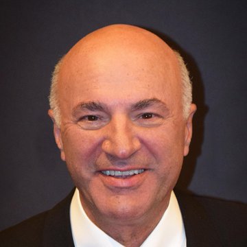 Kevin O'Leary smiling in a headshot, accompanying a post about his comments on the CLARITY Act's chances of passing amid concerns that the Iran conflict could derail legislative progress.
