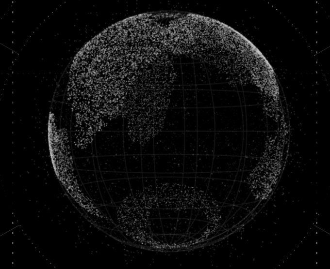 A black and white visualization of Earth as a sphere made of scattered particles, overlaid with a wireframe globe grid.
