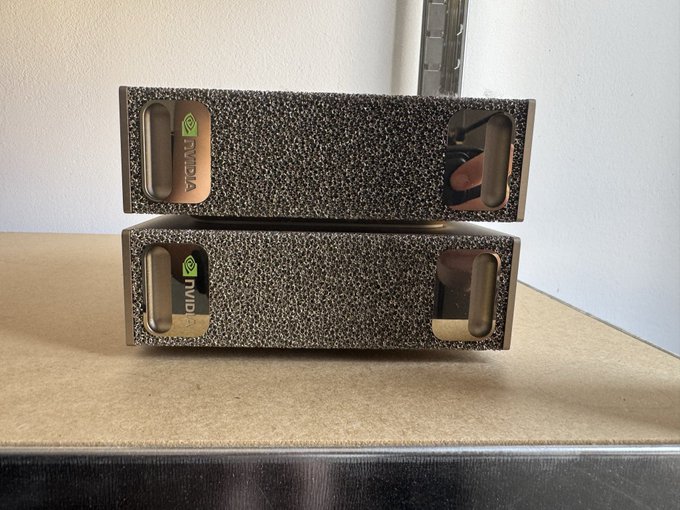 Two Nvidia boxes stacked on a stainless steel counter, fittingly captioned "Home sweet home." as the textured brown packaging rests in its new spot.