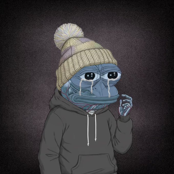 A cartoonish, sad blue frog-like creature wearing a cream-colored beanie with a pom-pom and a dark hoodie, crying big tears down its face.