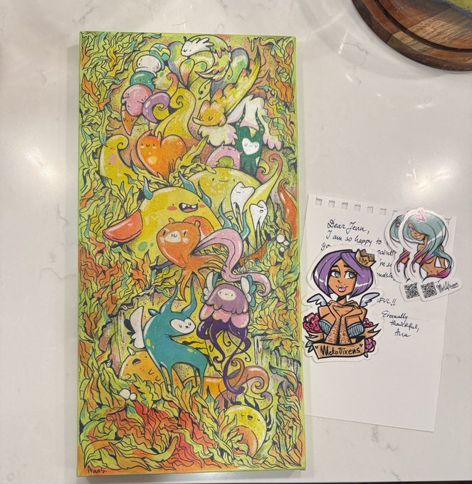 A colorful hand-drawn artwork featuring various whimsical creatures among leaves, displayed alongside a character illustration and a handwritten note from the artist.