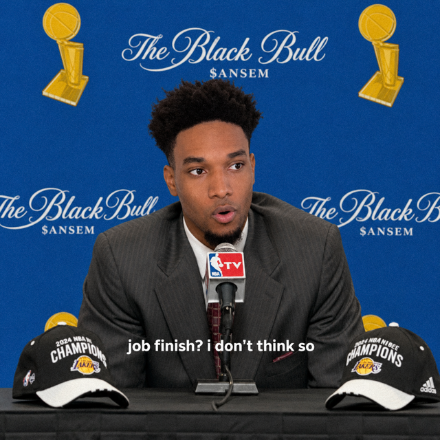 The image depicts a man in a suit at a press conference featuring "The Black Bull $ANSEM" backdrop and two "2024 NBA Champions" Los Angeles Lakers hats, with the subtitle "job finish? i don't think so".