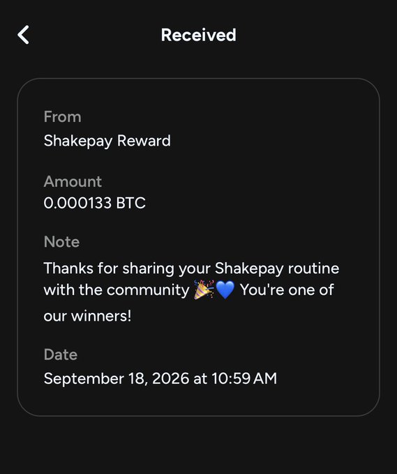A mobile app screenshot of a "Received" transaction from "Shakepay Reward" for "0.000133 BTC" with the note "Thanks for sharing your Shakepay routine with the community 🎉💙 You're one of our winners!" dated September 18, 2026.