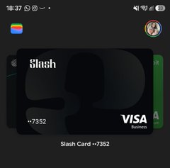 A smartphone screenshot showing a digital wallet with a green 'Slash Card +7352' Visa Business card displayed.