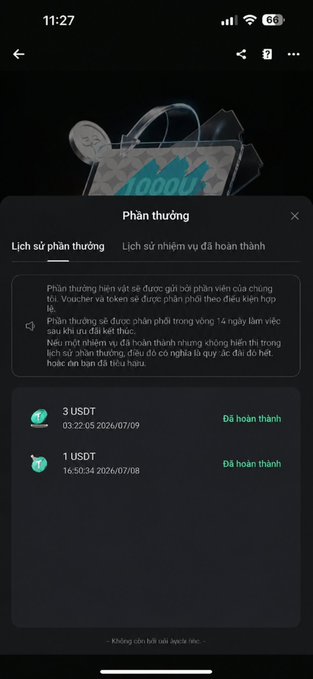 A Vietnamese mobile app screenshot titled 'Phần thưởng' (Rewards) showing a reward history section with completed rewards of 3 USDT and 1 USDT with timestamps from July 2026.