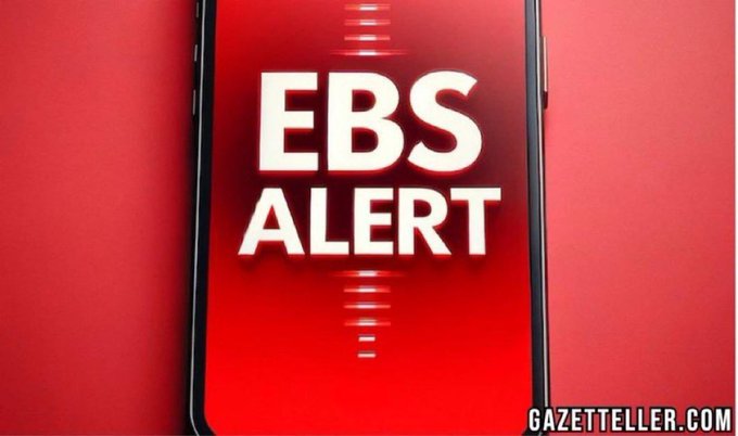 A smartphone screen displays the text "EBS ALERT" in bold white letters on a red background, with "GAZETTELLER.COM" visible in the corner.