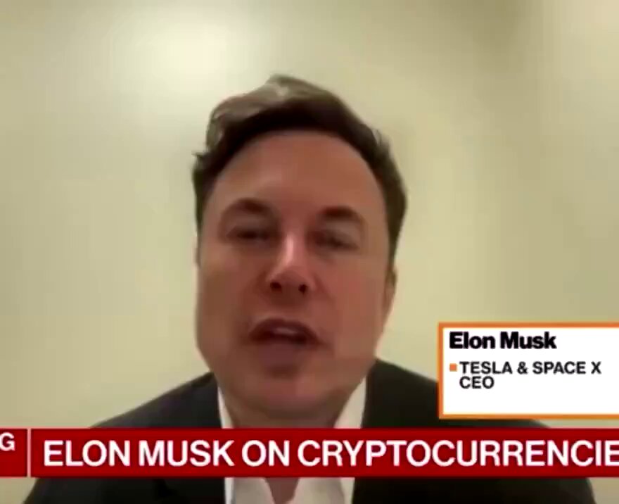 The image features a man wearing a suit, sitting at a desk with his head tilted back as he speaks into a microphone. The background of the image shows a white wall, which serves as a backdrop for the text that reads "Elon Musk on Cryptocurrency". This suggests that the image is related to a discussion or interview about cryptocurrency and its connection to Elon Musk's legacy.

The post also includes an image of a man wearing a suit with the caption "$Dogeus Maximus is carrying the @dogecoin legacy forward." The text in the image emphasizes the link between the man speaking into the microphone and the Dogecoin logo, indicating that the discussion might be about the intersection of cryptocurrency and the Dogecoin brand.