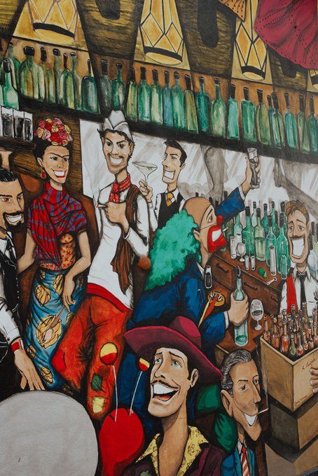 The image features a colorful cartoon drawing of people at a bar with various drinks and bottles around them. The scene includes a bartender, a clown, and several other characters enjoying their time together. The post about Mexico seems to be related to this illustration as it mentions "¡Viva México! Great couple of days at @Bitso ' s Stablecoin Conference." This suggests that the image might have been created for an event or promotion related to cryptocurrency, specifically stablecoins like Bitcoin Cash.