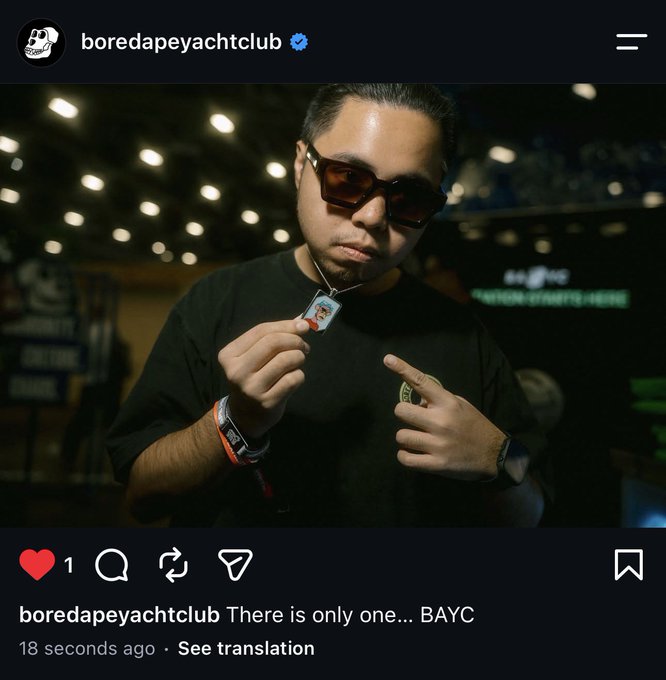 An Instagram post from the verified 'boredapeyachtclub' account featuring a man in sunglasses holding a BAYC NFT keychain, captioned 'There is only one... BAYC'.