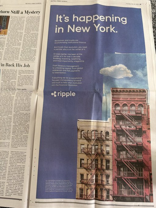 A full-page Wall Street Journal advertisement by Ripple displays the headline "It's happening in New York" alongside an image of colorful fire escapes, promoting blockchain and crypto's transformative role in rebuilding finance. The ad features Ripple's logo and discusses their partnership with institutions like the New York Department of Financial Services, as referenced in the accompanying post about Ripple's WSJ feature.