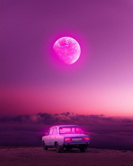 A vintage car sits beneath a vibrant pink moon in a dreamy, surreal sunset scene. The retro, otherworldly aesthetic pairs perfectly with the post's reflective, end-of-day mood, capturing that "turning up" chill energy even on a slow, rainy day.